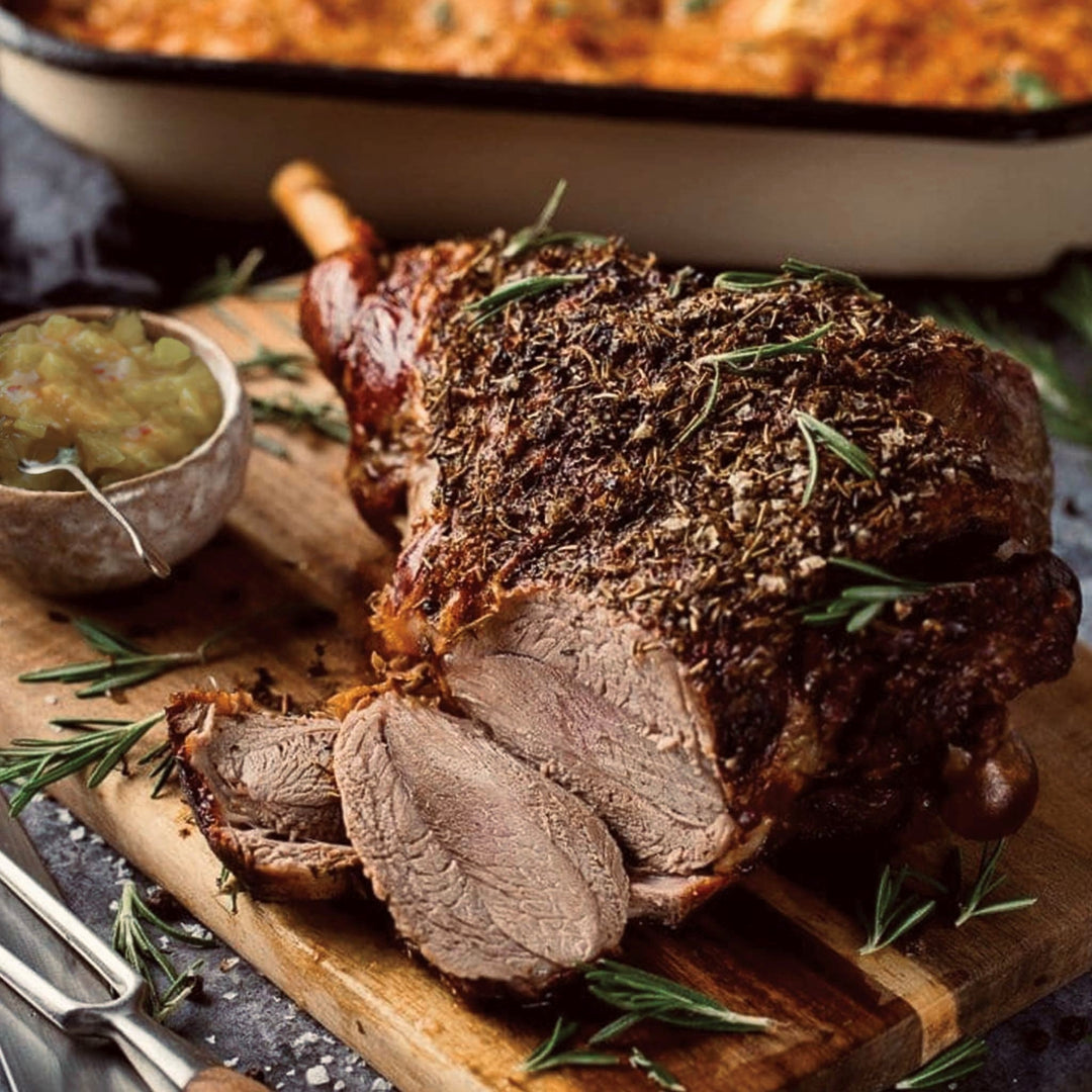 Herb crusted Easter roast lamb served with Women's Work Spicy Green Tomato Relish