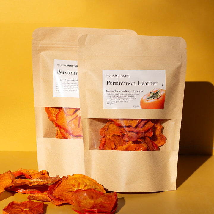 Two 60g pouches of Women's Work Persimmon Leather with dehydrated persimmon slices