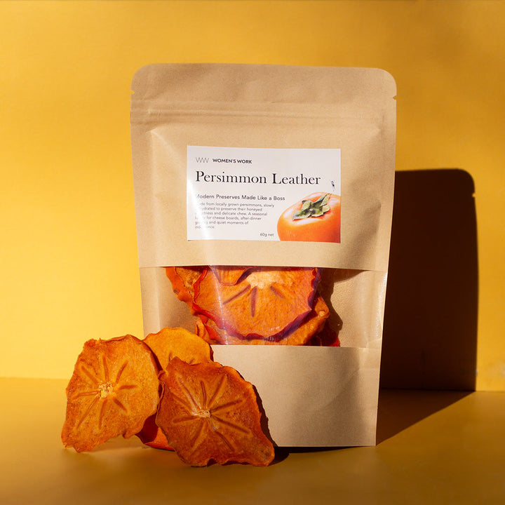 Women's Work Persimmon Leather 60g pouch with a pile of dried persimmon slices